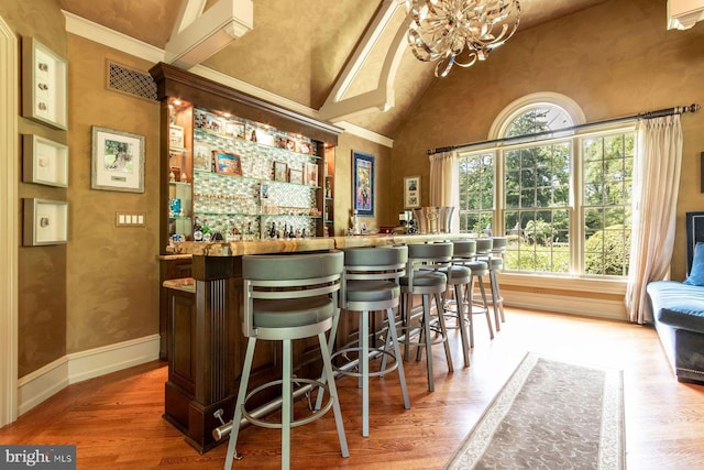 3500 Windy Bush Rd, New Hope, PA 18938 - indoor wet bar with plenty of natural light, wood finished floors, high vaulted ceiling, and a chandelier