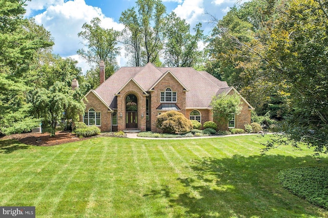3500 Windy Bush Rd, New Hope, PA 18938 - view of front of property featuring brick siding, a front lawn, and a chimney