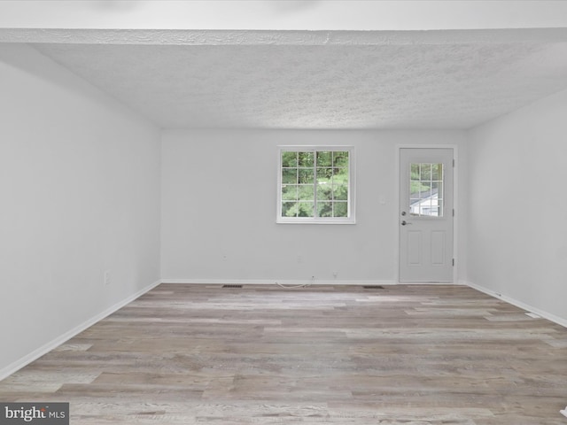 8456 Rocky Knob Ct, Lorton, VA 22079 - empty room with wood finished floors and a textured ceiling