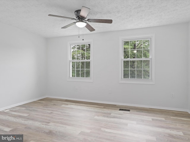8456 Rocky Knob Ct, Lorton, VA 22079 - unfurnished room featuring light wood-style floors, a textured ceiling, and a ceiling fan