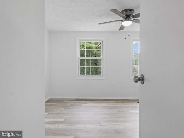 8456 Rocky Knob Ct, Lorton, VA 22079 - spare room with wood finished floors, a textured ceiling, and ceiling fan