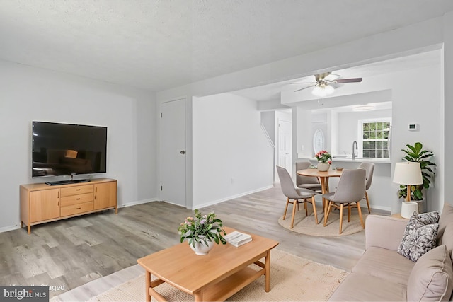8456 Rocky Knob Ct, Lorton, VA 22079 - living area featuring light wood-type flooring and ceiling fan