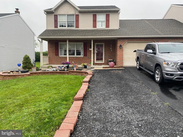117 S View Rd, Fleetwood, PA 19522 - traditional-style home with a garage, brick siding, asphalt driveway, and a front yard