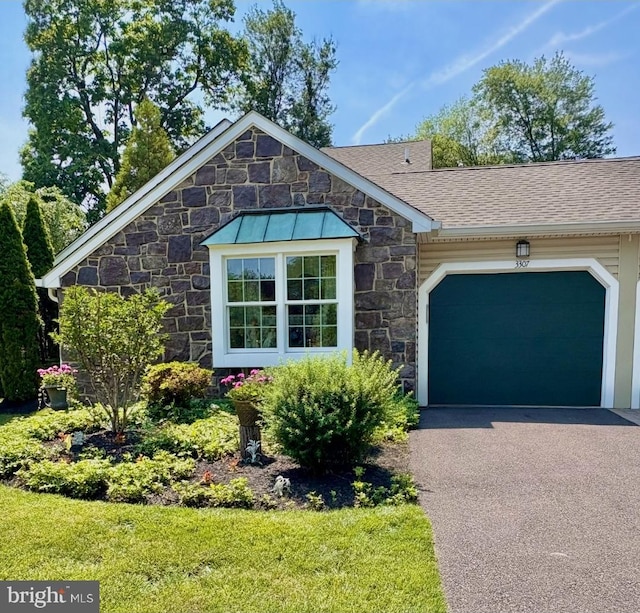 3307 Freemans Ln, Holland, PA 18966 - ranch-style home with stone siding, a garage, and driveway
