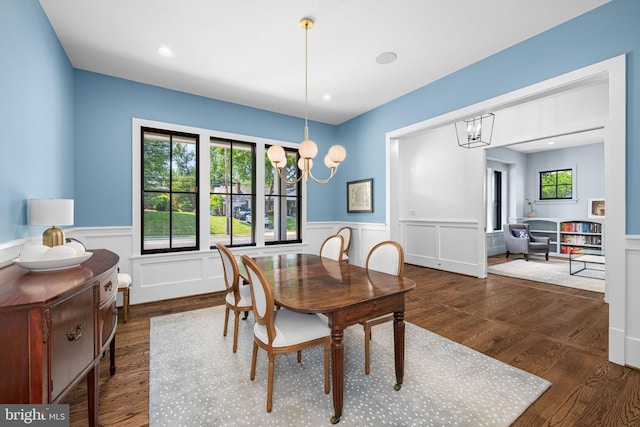 3433 N Edison St, Arlington, VA 22207 - dining room featuring wainscoting, wood finished floors, a chandelier, and a decorative wall