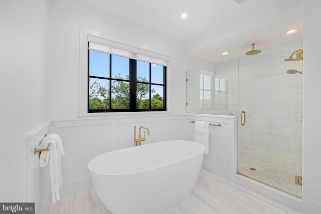 3433 N Edison St, Arlington, VA 22207 - full bath with a decorative wall, a shower stall, a soaking tub, recessed lighting, and a wainscoted wall