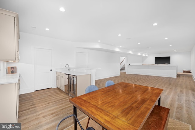 3433 N Edison St, Arlington, VA 22207 - dining area with light wood-type flooring, stairs, recessed lighting, and wet bar