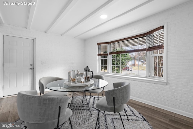 7012 Nashville Ct, Lanham, MD 20706 - dining area with wood finished floors, brick wall, and beam ceiling