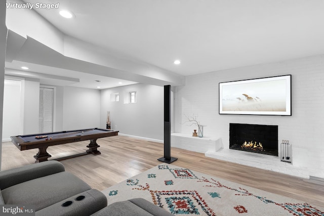 7012 Nashville Ct, Lanham, MD 20706 - playroom with wood finished floors, a fireplace, billiards, and recessed lighting