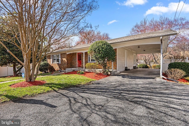 7012 Nashville Ct, Lanham, MD 20706 - ranch-style house featuring asphalt driveway, brick siding, and an attached carport