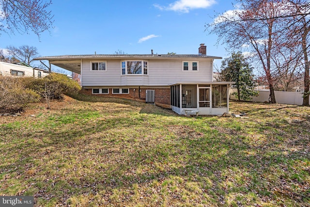 7012 Nashville Ct, Lanham, MD 20706 - rear view of house featuring a sunroom, a chimney, and brick siding