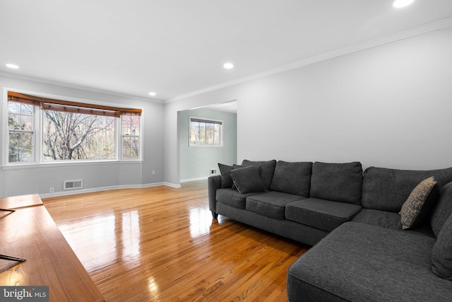 7012 Nashville Ct, Lanham, MD 20706 - living area with light wood-style flooring, ornamental molding, and recessed lighting