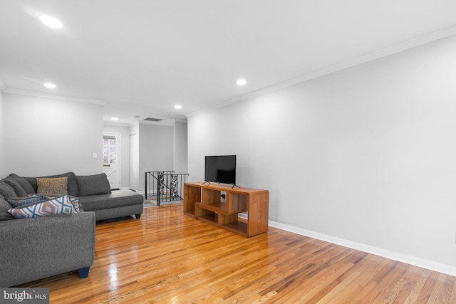 7012 Nashville Ct, Lanham, MD 20706 - living room featuring light wood finished floors, recessed lighting, and crown molding