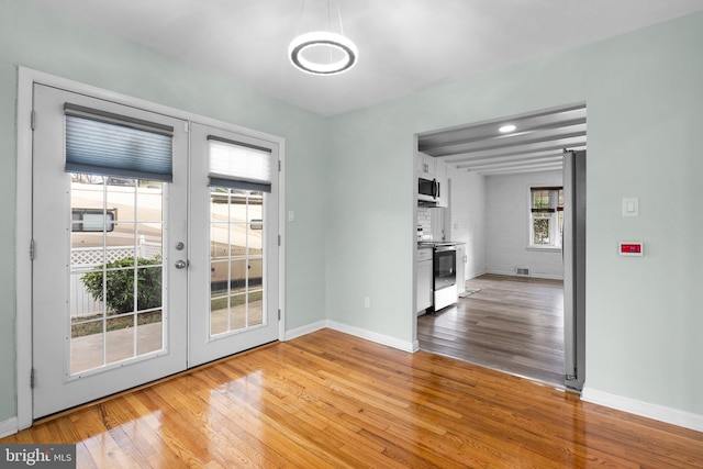 7012 Nashville Ct, Lanham, MD 20706 - unfurnished dining area featuring french doors and wood finished floors