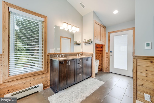 3814 Estel Rd, Fairfax, VA 22031 - full bath featuring a baseboard radiator, lofted ceiling, double vanity, and tile patterned floors