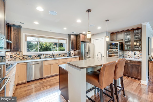 3814 Estel Rd, Fairfax, VA 22031 - kitchen with stainless steel appliances, beverage cooler, tasteful backsplash, light countertops, and glass insert cabinets