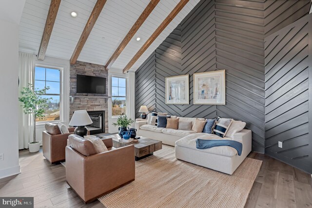 500 Halma Ct, Havre De Grace, MD 21078 - living area featuring plenty of natural light, a fireplace, hardwood / wood-style floors, high vaulted ceiling, and wood walls