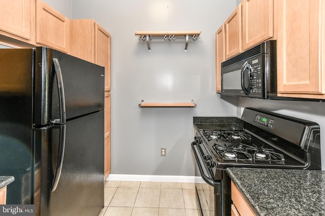 355 I St SW Unit S-102, Washington, DC 20024 - kitchen with black appliances, light tile patterned floors, light brown cabinetry, and dark stone counters