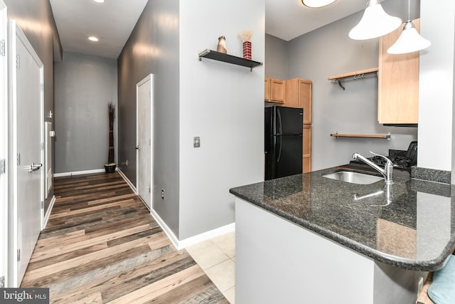 355 I St SW Unit S-102, Washington, DC 20024 - kitchen with freestanding refrigerator, open shelves, light brown cabinetry, recessed lighting, and light wood-type flooring