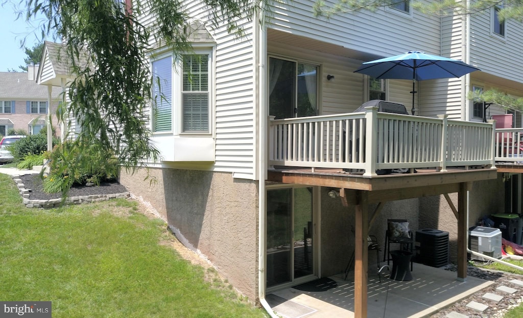 1263 Maple Glen Cir, Pottstown, PA 19464 - rear view of property with a deck, a patio, and a lawn