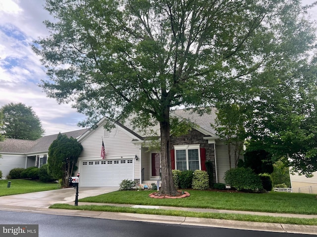 7 Covington Dr, Fredericksburg, VA 22406 - view of front facade featuring concrete driveway, stone siding, a front yard, and a garage