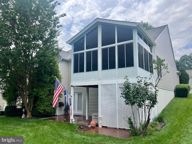 7 Covington Dr, Fredericksburg, VA 22406 - back of property with a lawn, a sunroom, and a patio