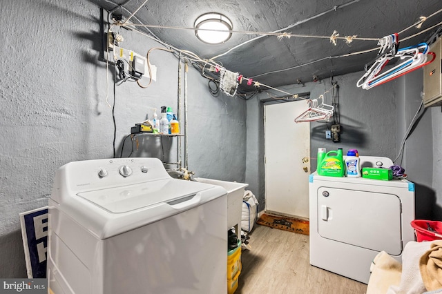 246 Le Carra Dr, Lansdowne, PA 19050 - laundry room with washer and dryer and wood finished floors