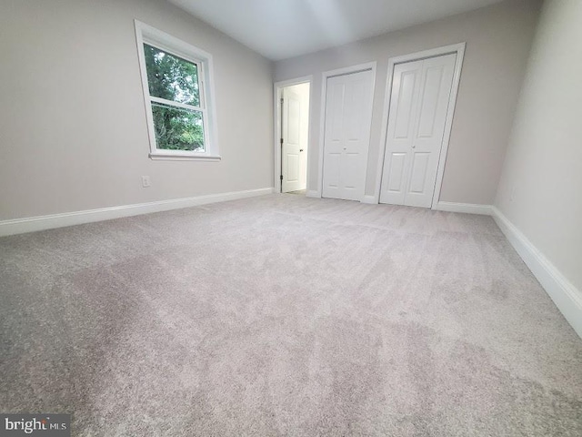 258 Ridge Rd, Browns Mills, NJ 08015 - unfurnished bedroom with two closets and carpet floors