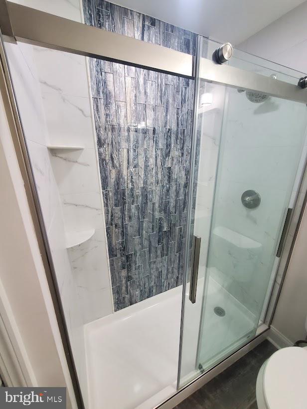 258 Ridge Rd, Browns Mills, NJ 08015 - bathroom with toilet and a stall shower