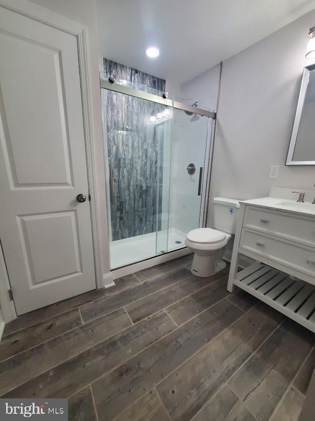 258 Ridge Rd, Browns Mills, NJ 08015 - full bathroom with hardwood / wood-style floors, vanity, and a stall shower