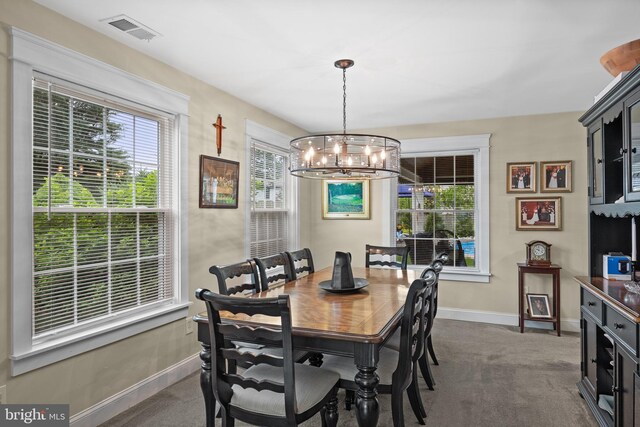 47 Sherwood Ln, Westampton, NJ 08060 - carpeted dining space with a chandelier and baseboards