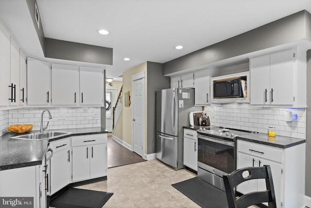 47 Sherwood Ln, Westampton, NJ 08060 - kitchen featuring appliances with stainless steel finishes, dark countertops, white cabinetry, tasteful backsplash, and recessed lighting