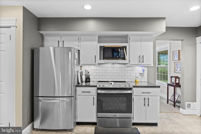 47 Sherwood Ln, Westampton, NJ 08060 - kitchen featuring stainless steel appliances, tasteful backsplash, white cabinetry, recessed lighting, and dark stone countertops