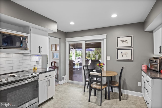 47 Sherwood Ln, Westampton, NJ 08060 - kitchen featuring stainless steel range with electric cooktop, black microwave, white cabinets, backsplash, and recessed lighting