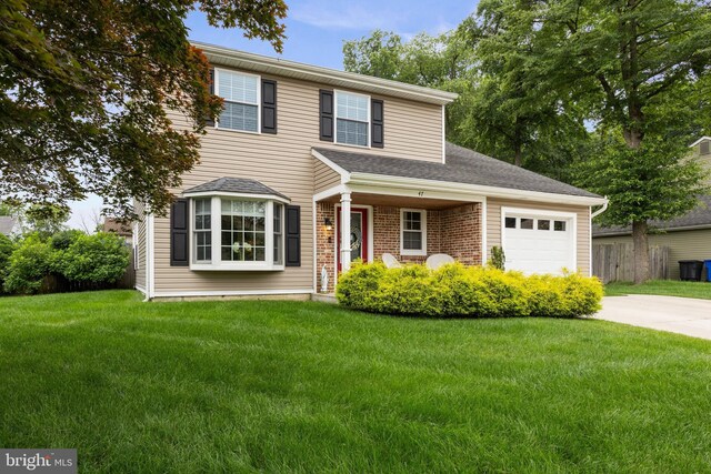47 Sherwood Ln, Westampton, NJ 08060 - traditional-style home featuring a garage, concrete driveway, a front yard, and brick siding