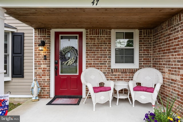 47 Sherwood Ln, Westampton, NJ 08060 - doorway to property featuring brick siding and a porch