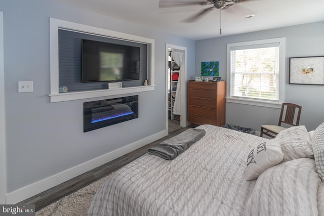 47 Sherwood Ln, Westampton, NJ 08060 - bedroom featuring a walk in closet, wood finished floors, a closet, and a ceiling fan
