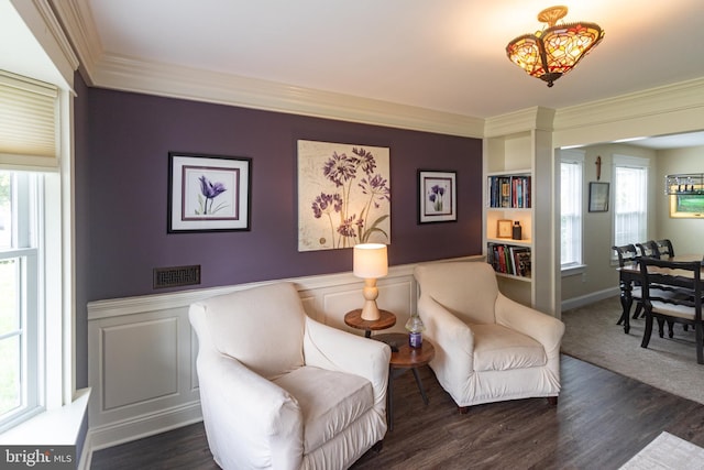 47 Sherwood Ln, Westampton, NJ 08060 - sitting room with ornamental molding, plenty of natural light, wainscoting, wood finished floors, and built in features