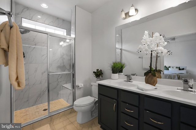 1025 Overlook Way, Laurel, MD 20707 - ensuite bathroom with marble look tile flooring, double vanity, a shower stall, and recessed lighting