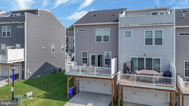 1025 Overlook Way, Laurel, MD 20707 - back of house with an attached garage, driveway, and a lawn