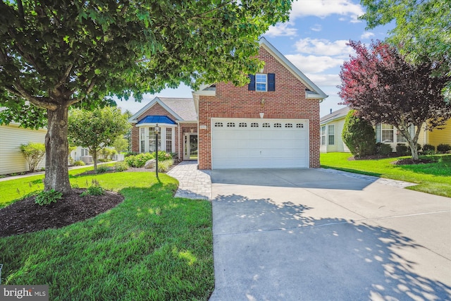 16916 Four Seasons Dr, Dumfries, VA 22025 - traditional-style home with brick siding, concrete driveway, and a front lawn