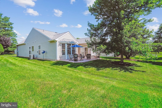 16916 Four Seasons Dr, Dumfries, VA 22025 - rear view of property featuring a patio and a yard