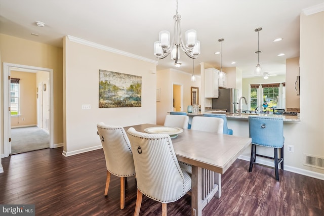 16916 Four Seasons Dr, Dumfries, VA 22025 - dining area with dark wood finished floors, recessed lighting, a chandelier, and crown molding