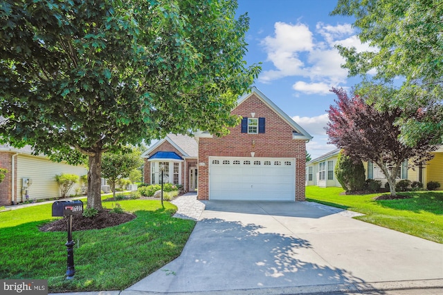 16916 Four Seasons Dr, Dumfries, VA 22025 - traditional home with driveway, brick siding, a garage, and a front lawn