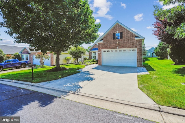 16916 Four Seasons Dr, Dumfries, VA 22025 - traditional-style home with concrete driveway, a front yard, and brick siding