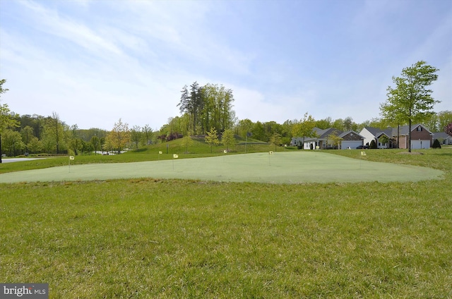 16916 Four Seasons Dr, Dumfries, VA 22025 - view of green lawn with a putting green and driveway