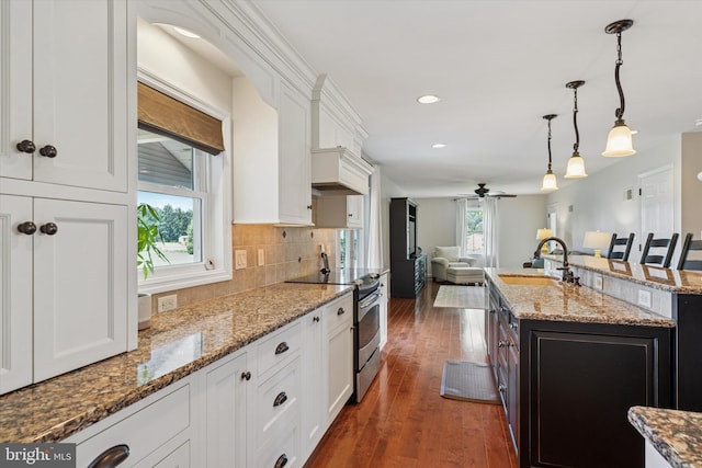 5790 Cedar Glen Dr, Narvon, PA 17555 - kitchen with stainless steel electric range oven, white cabinetry, open floor plan, and recessed lighting