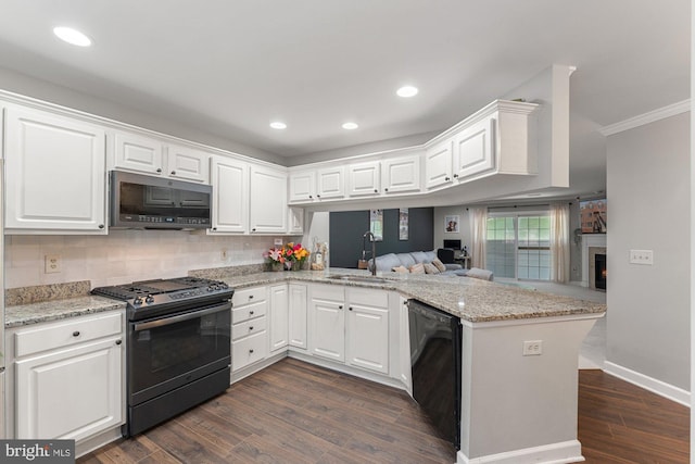 6908 Fairfax Dr Unit 202, Arlington, VA 22213 - kitchen featuring stainless steel appliances, a peninsula, white cabinetry, ornamental molding, and recessed lighting
