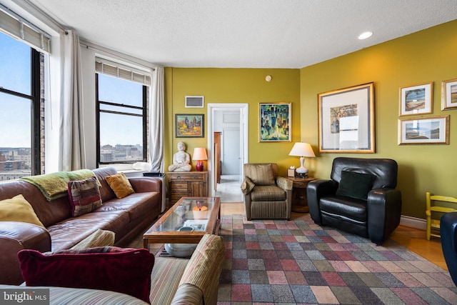 1615 Q St NW Unit 1001, Washington, DC 20009 - living area featuring a textured ceiling and recessed lighting