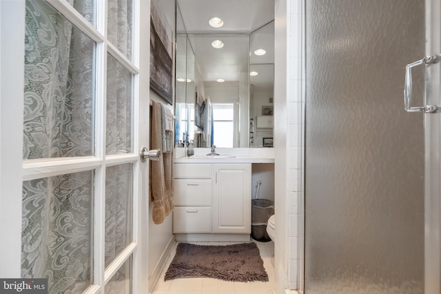 1615 Q St NW Unit 1001, Washington, DC 20009 - bathroom with vanity, a shower stall, tile patterned flooring, and recessed lighting